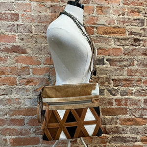 MYRA CROSSBODY WITH THE BOTTOM IN TRIANGLES WITH BLACK WHITE TAN IN COWHIDE