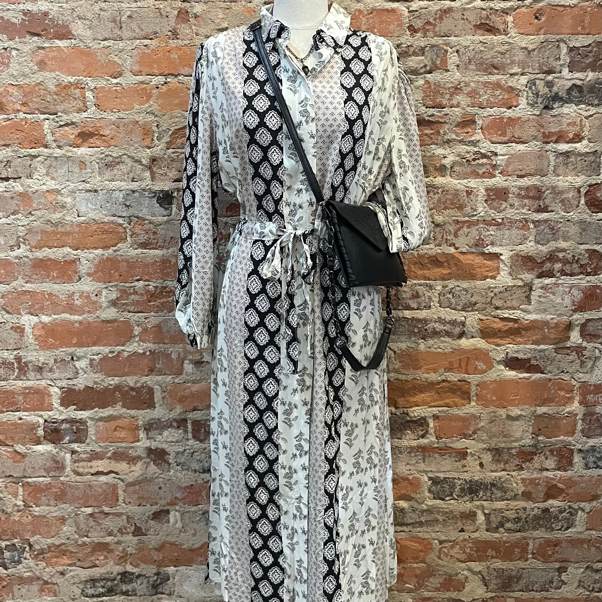 UMGEE FLORAL PRINT DRESS IN BLACK WHITE AND TAN LONG SLEEVE TIE AT WAIST
