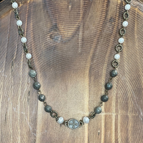NECKLACE BEADED IN GRAY AND WHITE WITH CROSS AT BOTTOM